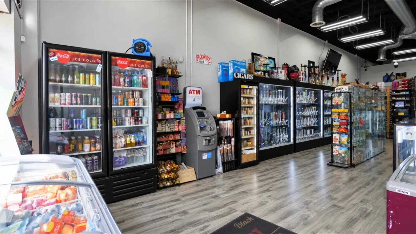 Inside: cold drink fridges and snack shelves